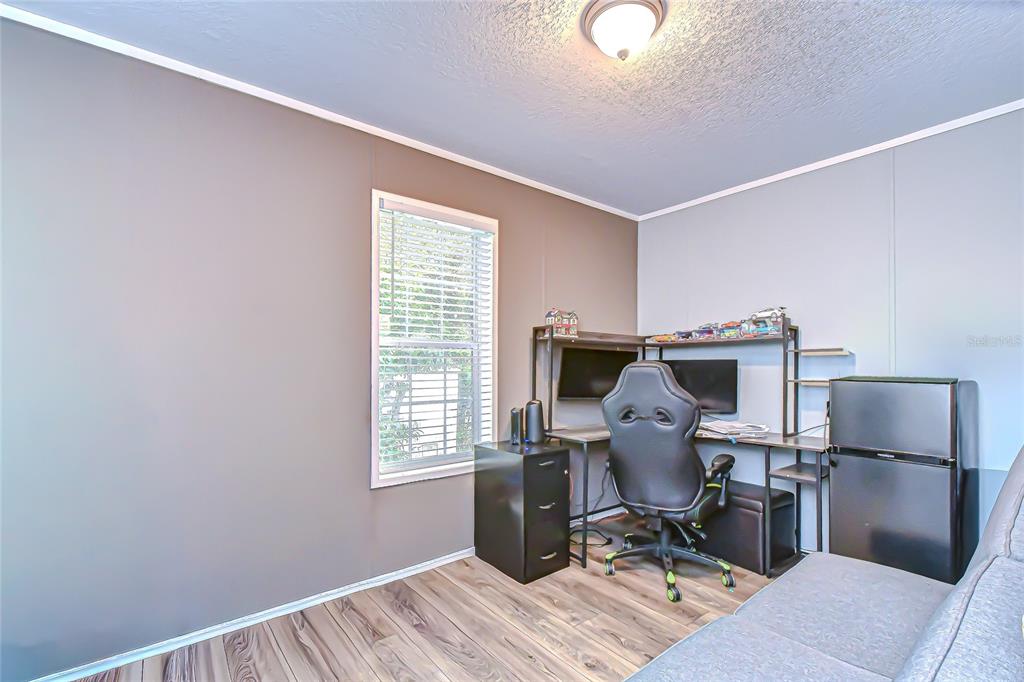 37749 Geiger Road Zephyrhills, FL 33542 - Photo 26 of 36 a workspace with furniture and a window