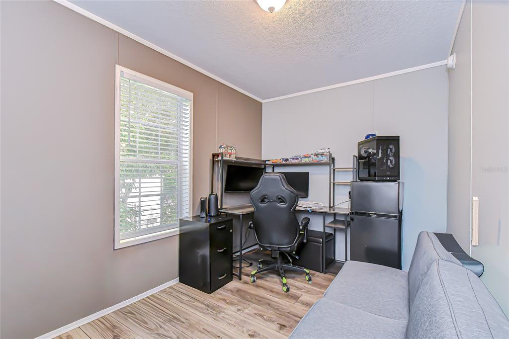37749 Geiger Road Zephyrhills, FL 33542 - Photo 27 of 36 a workspace with furniture and a window