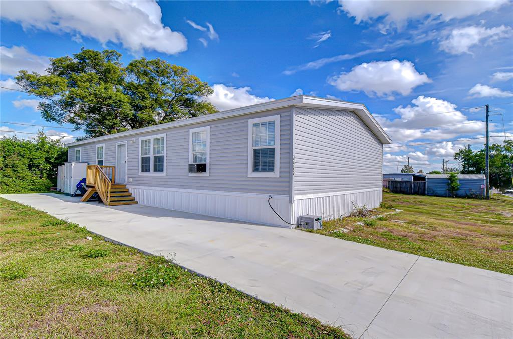 37749 Geiger Road Zephyrhills, FL 33542 - Photo 35 of 36 a view of a backyard of the house