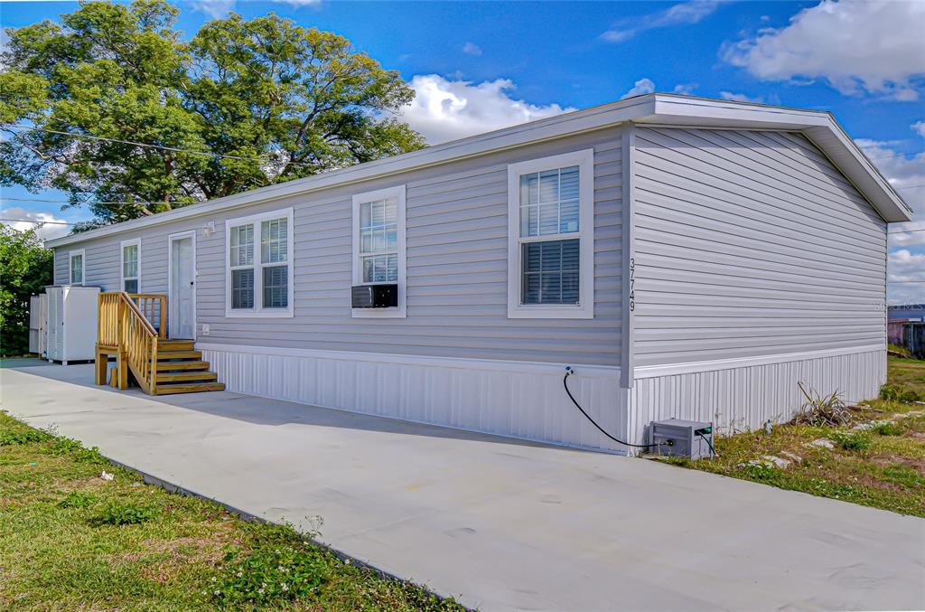37749 Geiger Road Zephyrhills, FL 33542 - Photo 36 of 36 a view of a house with backyard and sitting area