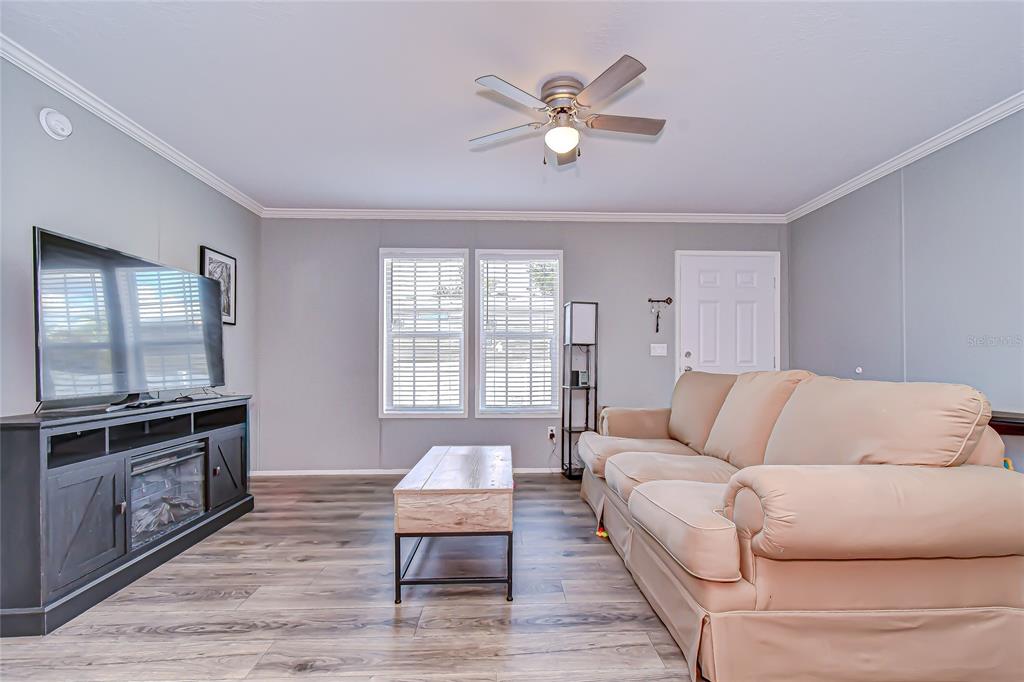 37749 Geiger Road Zephyrhills, FL 33542 - Photo 8 of 36 a living room with furniture and a large window