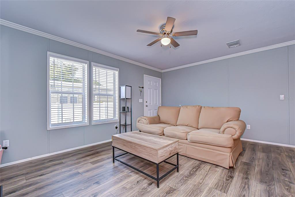 37749 Geiger Road Zephyrhills, FL 33542 - Photo 9 of 36 a living room with furniture and a window