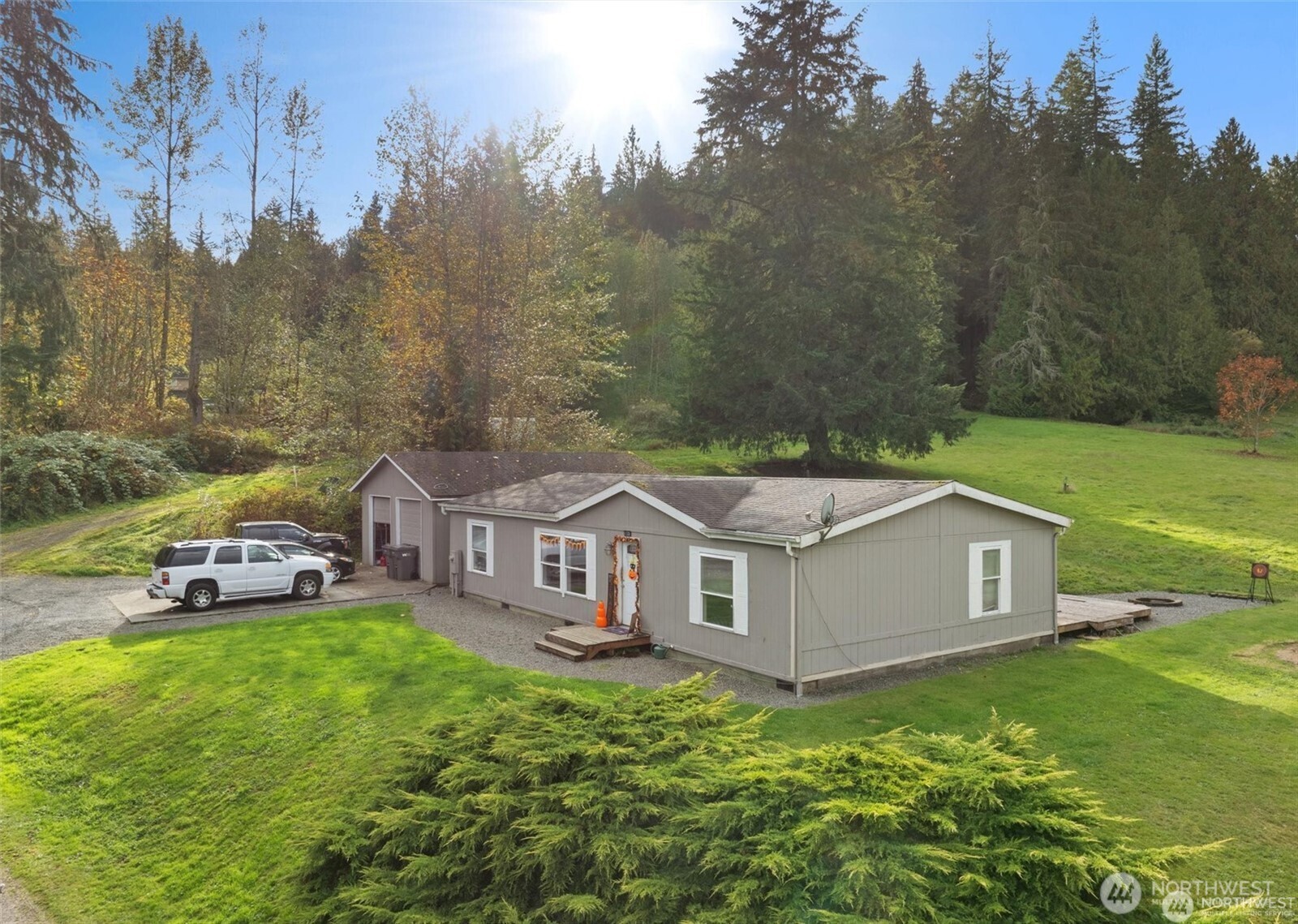 1526 Connors Road Snohomish, WA 98290 - Photo 1 of 1 a aerial view of a house with a yard table and chairs
