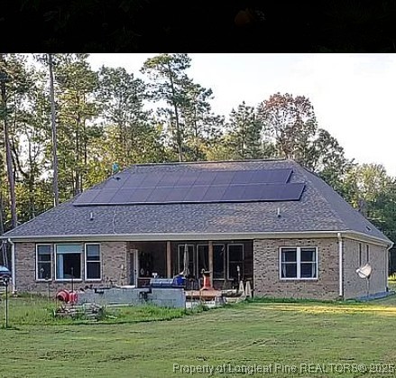 5535 Autryville Road Autryville, NC 28318 - Photo 2 of 22 a house view with a seating space and garden