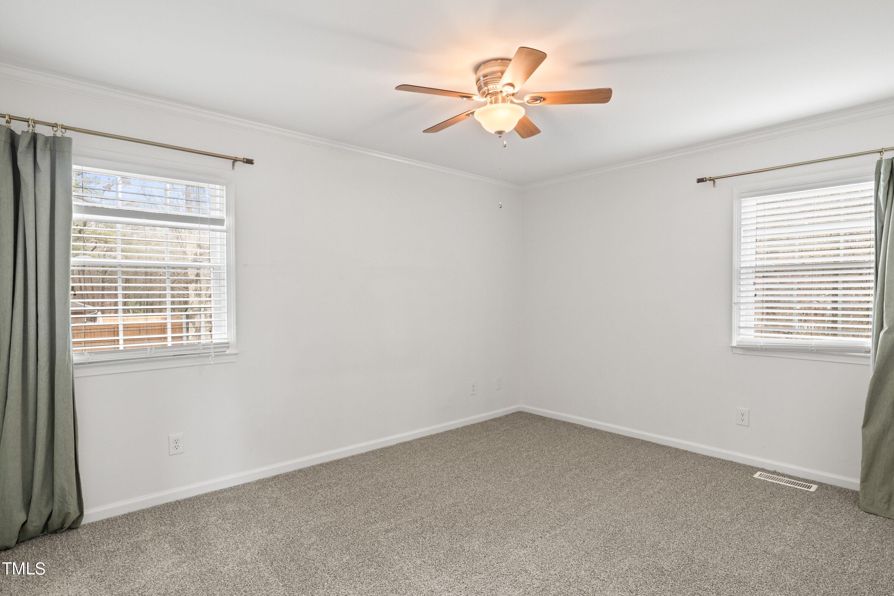 1 Kellom Court Durham, NC 27713 - Photo 20 of 33 an empty room with a window and a fan