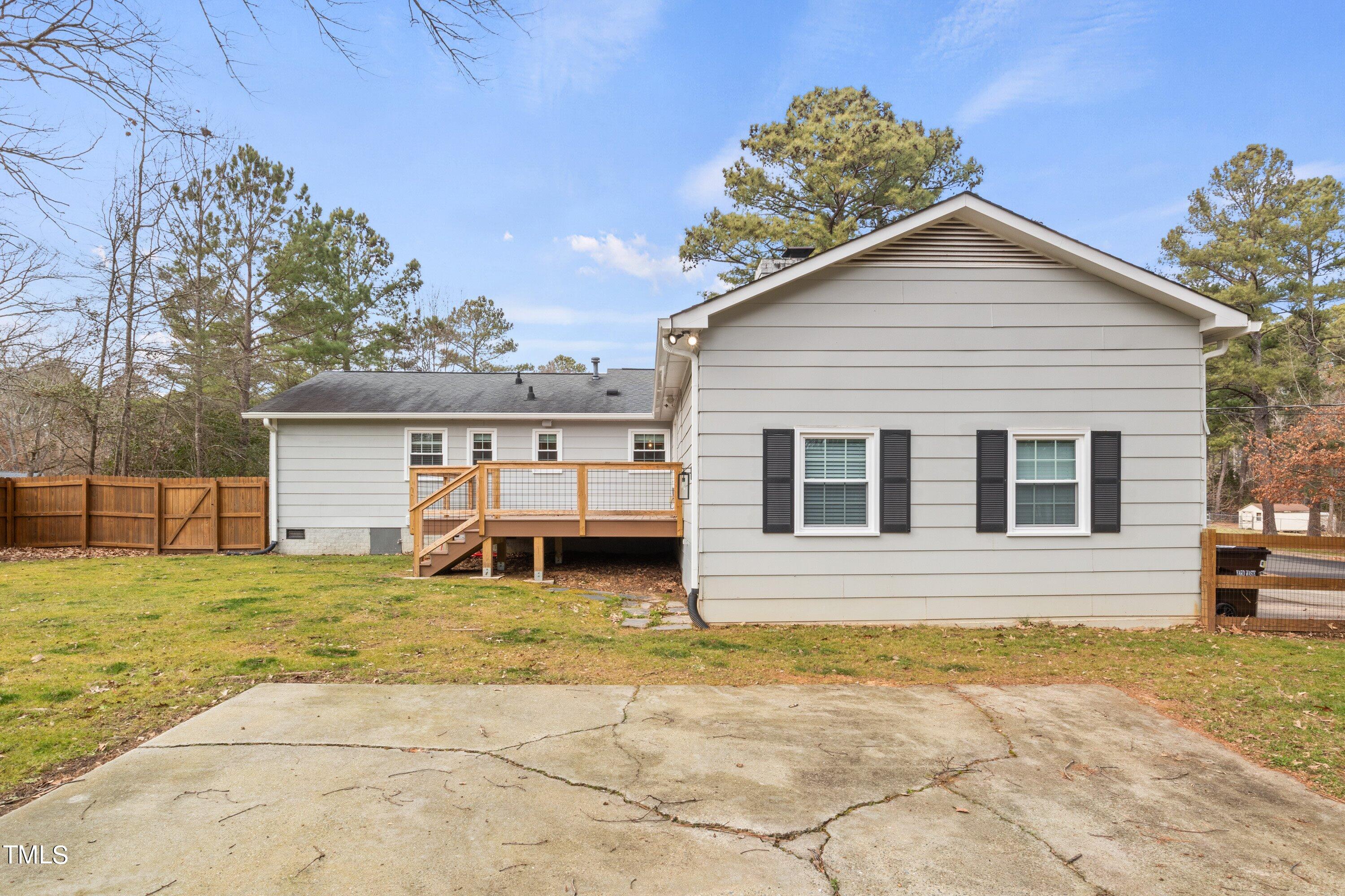 1 Kellom Court Durham, NC 27713 - Photo 26 of 33 a view of a house with a yard and a garage