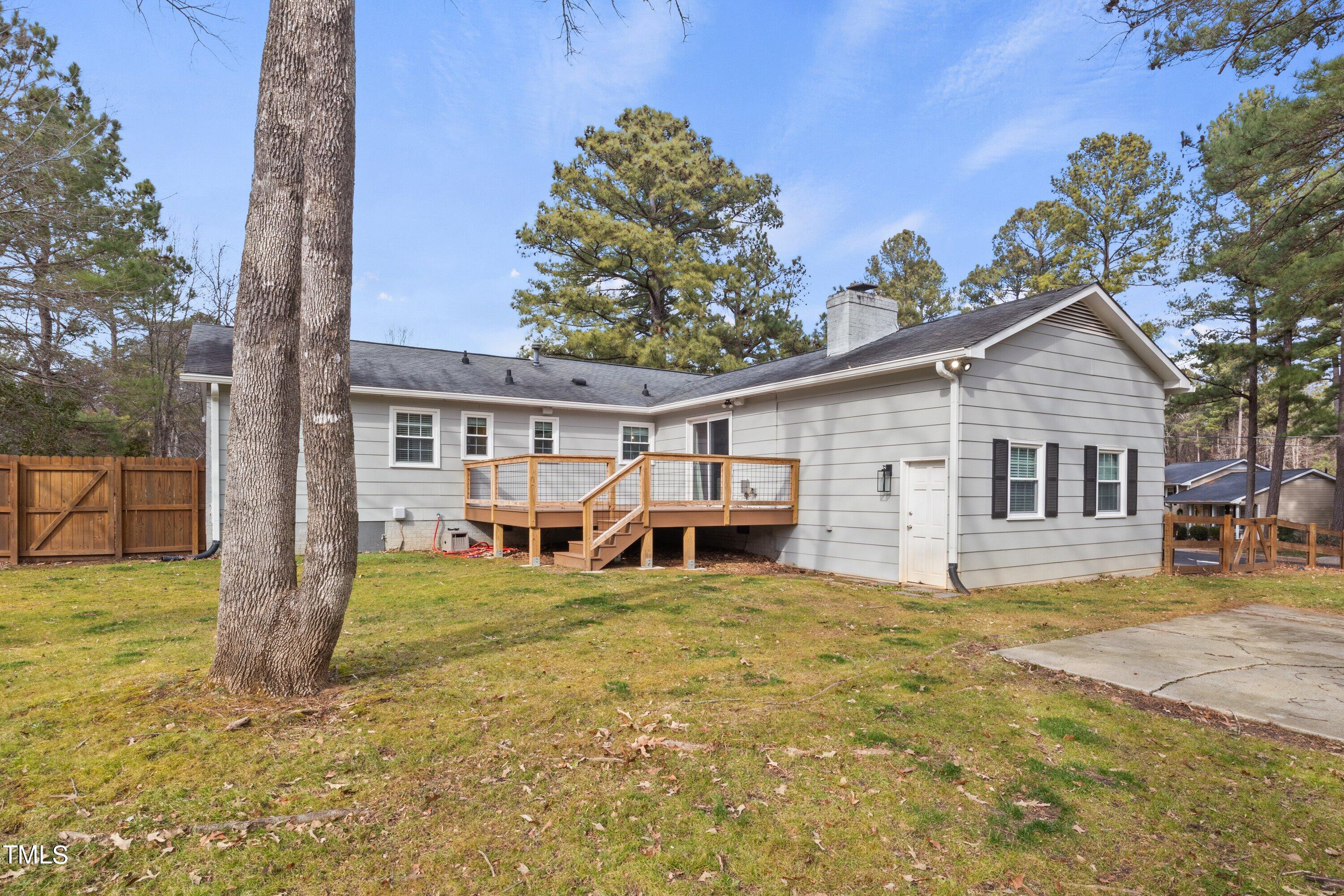 1 Kellom Court Durham, NC 27713 - Photo 30 of 33 a view of a house with a yard and sitting area