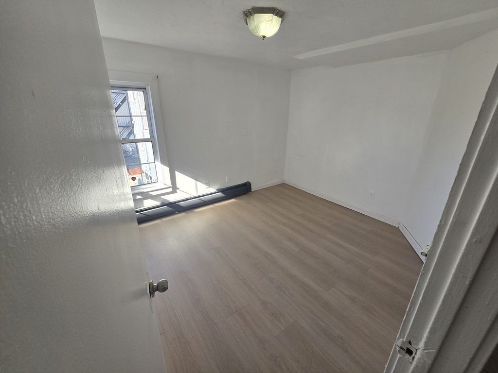 176 Green Street, Unit 2 Brockton, MA 02301 - Photo 3 of 15 a view of empty room with window