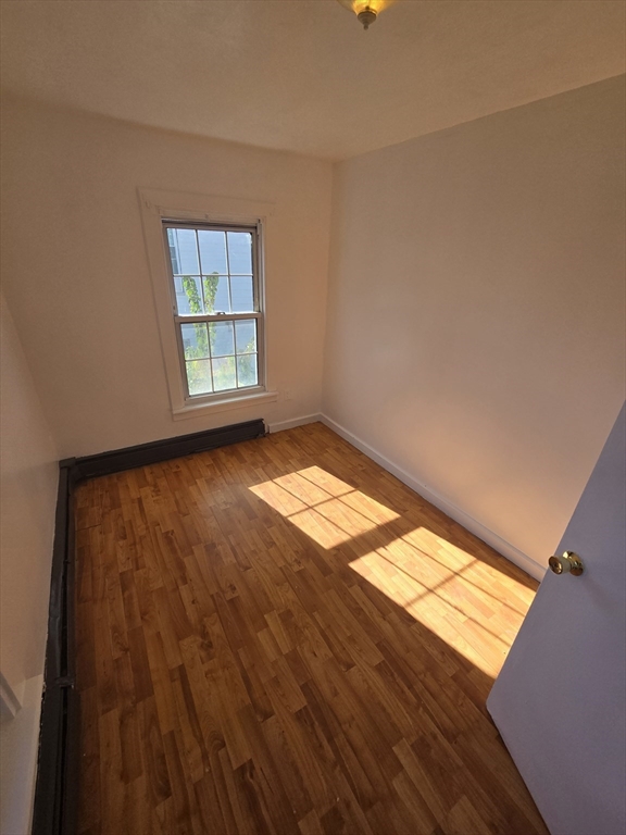 176 Green Street, Unit 2 Brockton, MA 02301 - Photo 7 of 15 a view of an empty room and window