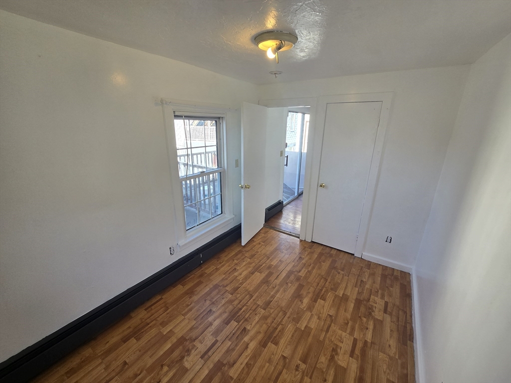 176 Green Street, Unit 2 Brockton, MA 02301 - Photo 8 of 15 a view of an empty room and window