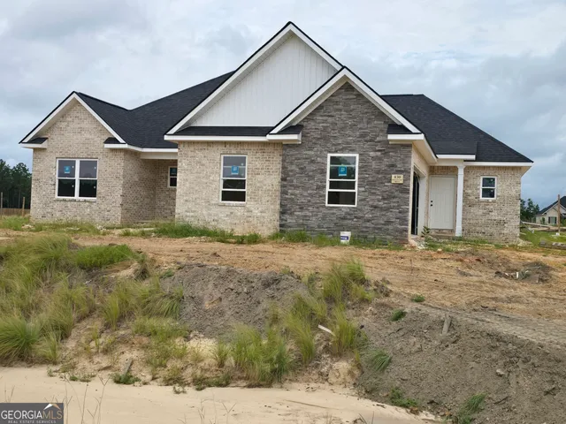 a view of front of house with a yard