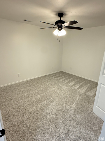 10158 High Point Lane Sandy, UT 84092 - Photo 19 of 24 Plush carpeting, neutral wall tones, and a ceiling fan with integrated lighting