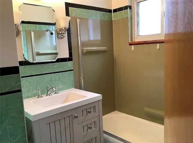 a bathroom with a sink and mirror