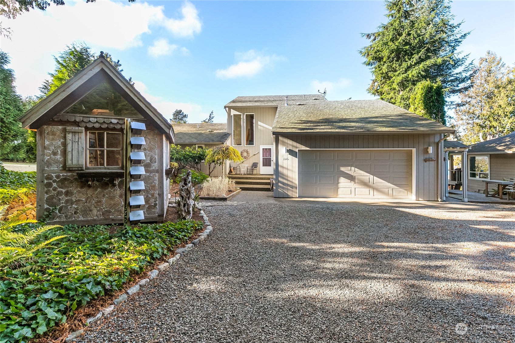 3376 Northgate Road Bellingham, WA 98226 - Photo 2 of 38 a front view of a house with a yard and garage