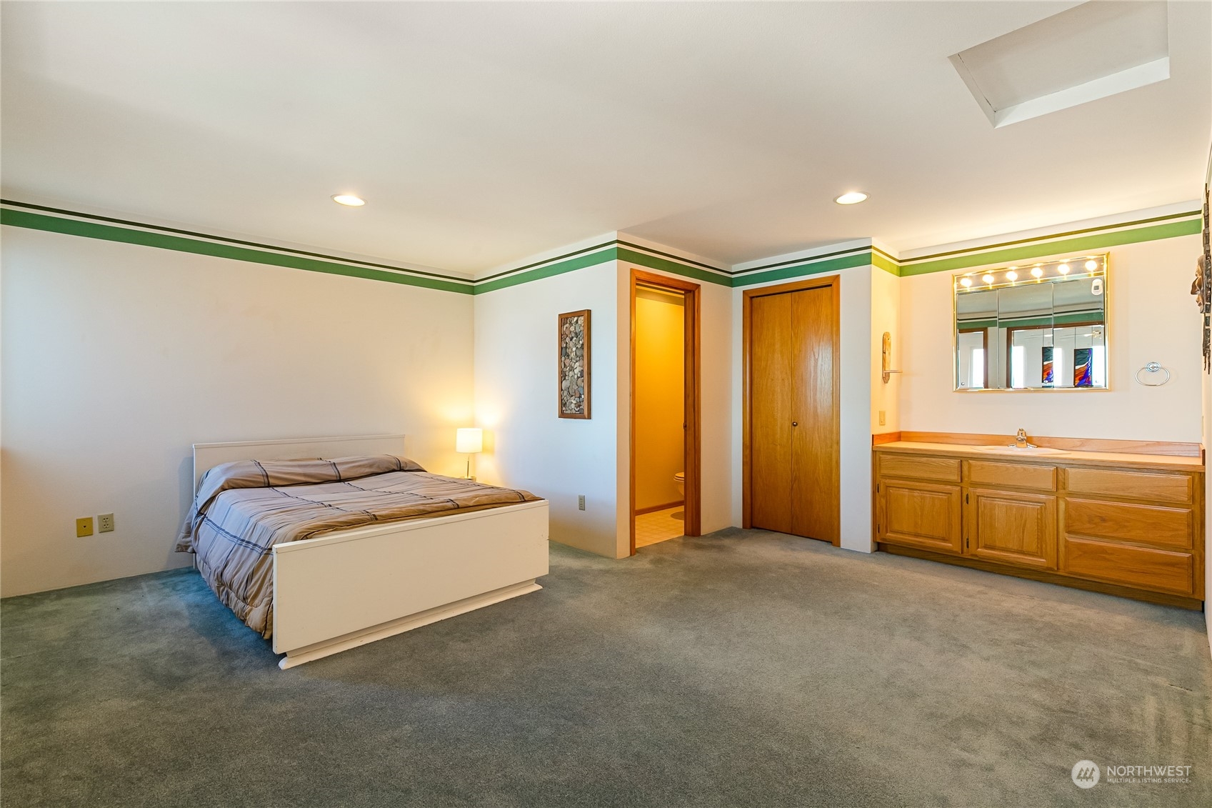 3376 Northgate Road Bellingham, WA 98226 - Photo 24 of 38 a spacious bedroom with a bed and a cabinets