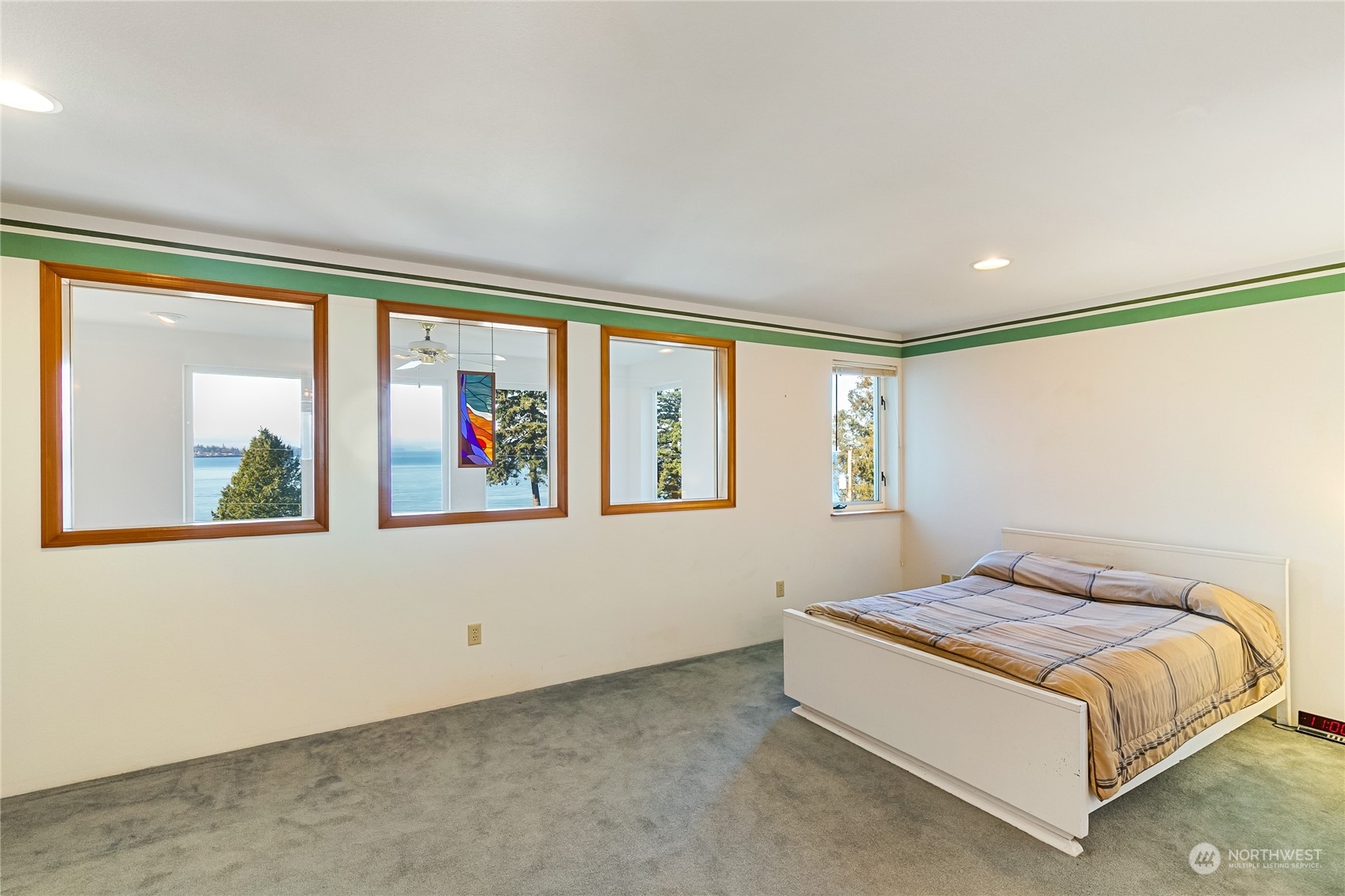 3376 Northgate Road Bellingham, WA 98226 - Photo 25 of 38 a bedroom with a large bed and a large window