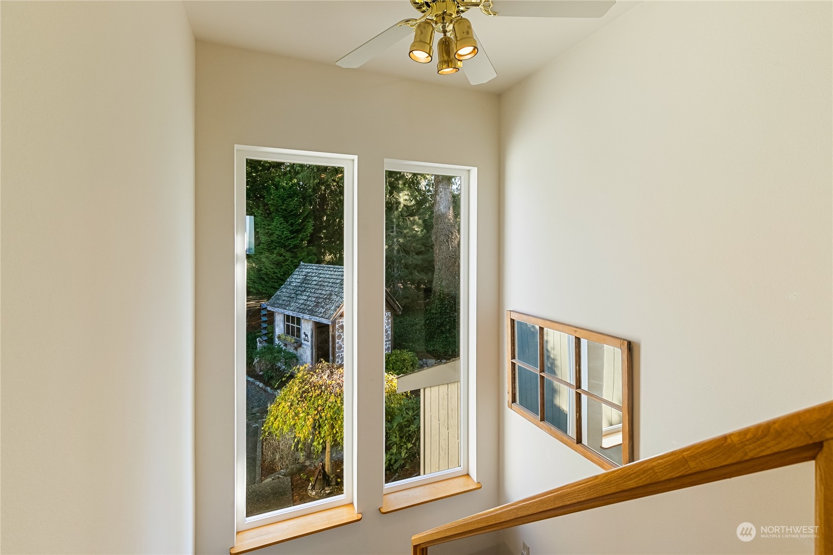 3376 Northgate Road Bellingham, WA 98226 - Photo 27 of 38 a view of a livingroom with a floor to ceiling window and wooden floor
