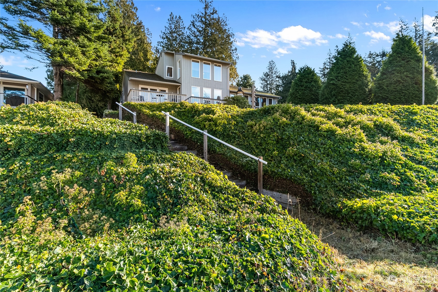 3376 Northgate Road Bellingham, WA 98226 - Photo 36 of 38 a view of a house with a small yard and large trees