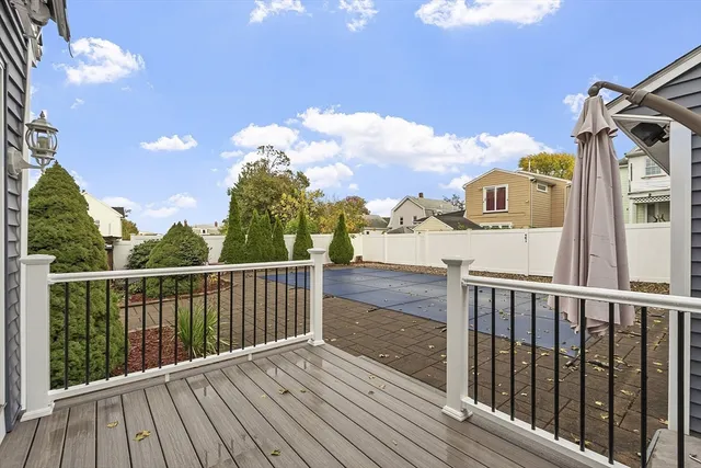 a view of a balcony with wooden floor