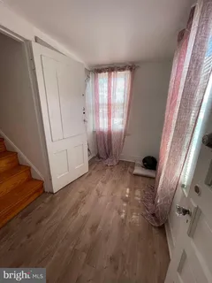 a kitchen with a refrigerator and a sink