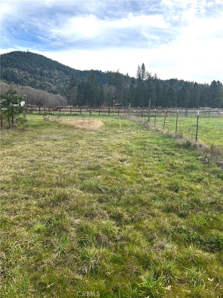9505 Salmina Road Kelseyville, CA 95451 - Photo 11 of 13 a view of a lake with mountains in the background