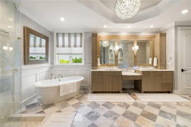 a large bathroom with a large tub shower and sink