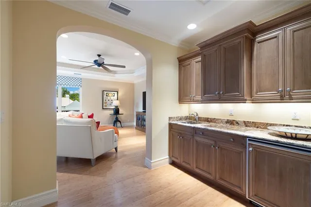 a kitchen with a sink and cabinets