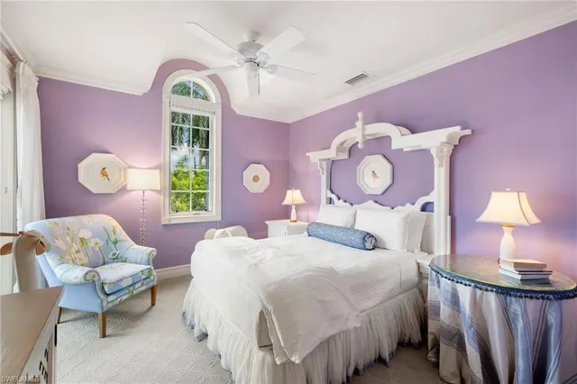 a bedroom with a bed dresser and a window