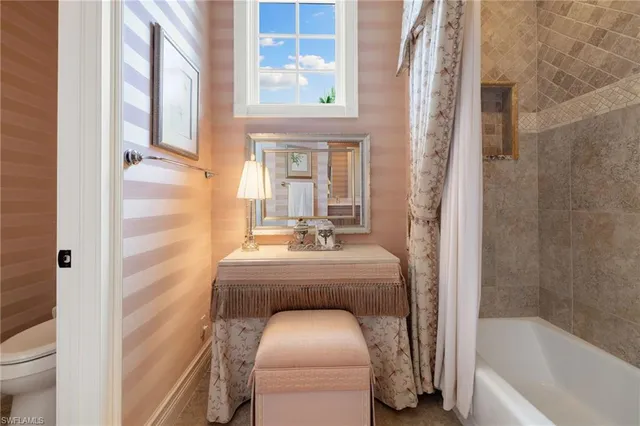 a bathroom with a bathtub sink and toilet