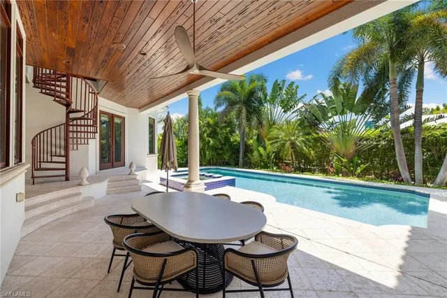 a outdoor dining space with furniture and garden view