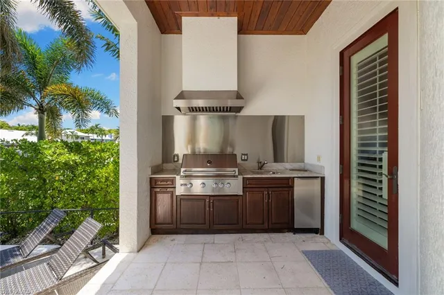 a kitchen with stainless steel appliances a stove and a refrigerator