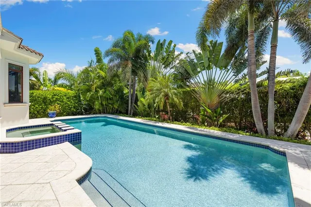 a view of swimming pool with a yard