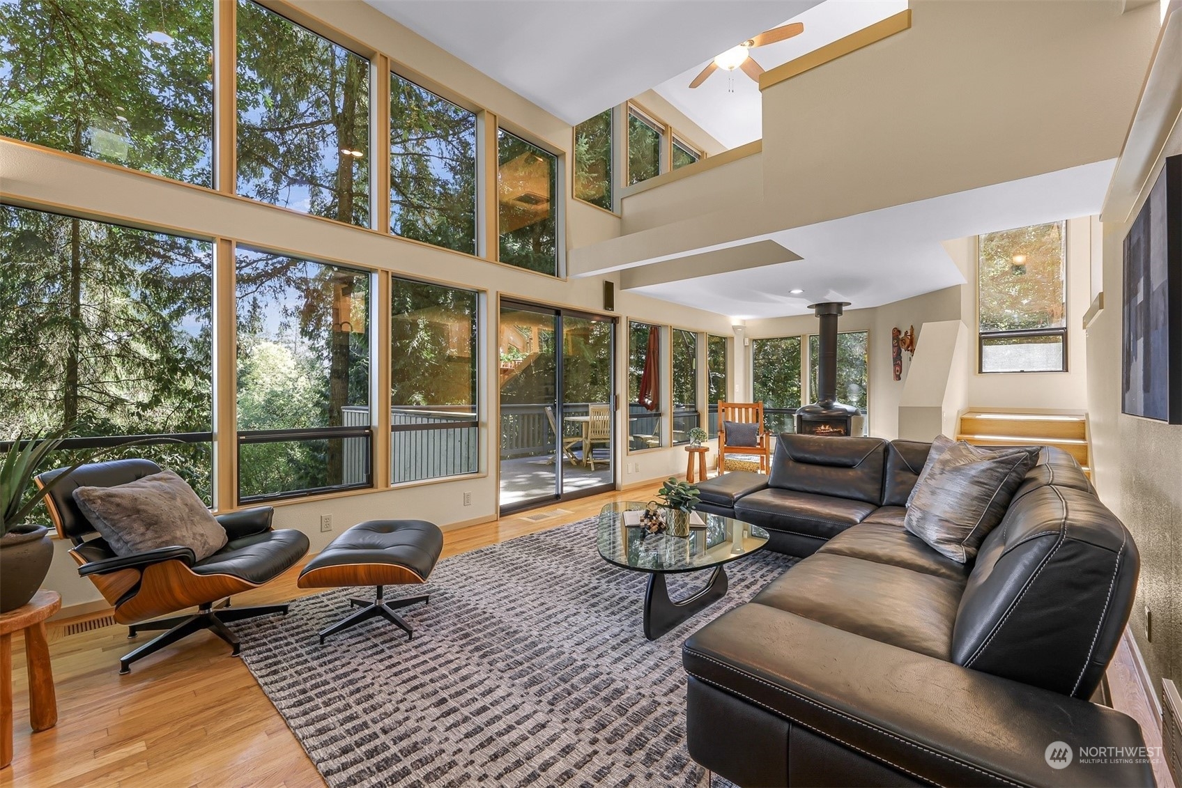 4431 Ferncroft Road Mercer Island, WA 98040 - Photo 4 of 40 a living room with furniture and floor to ceiling windows