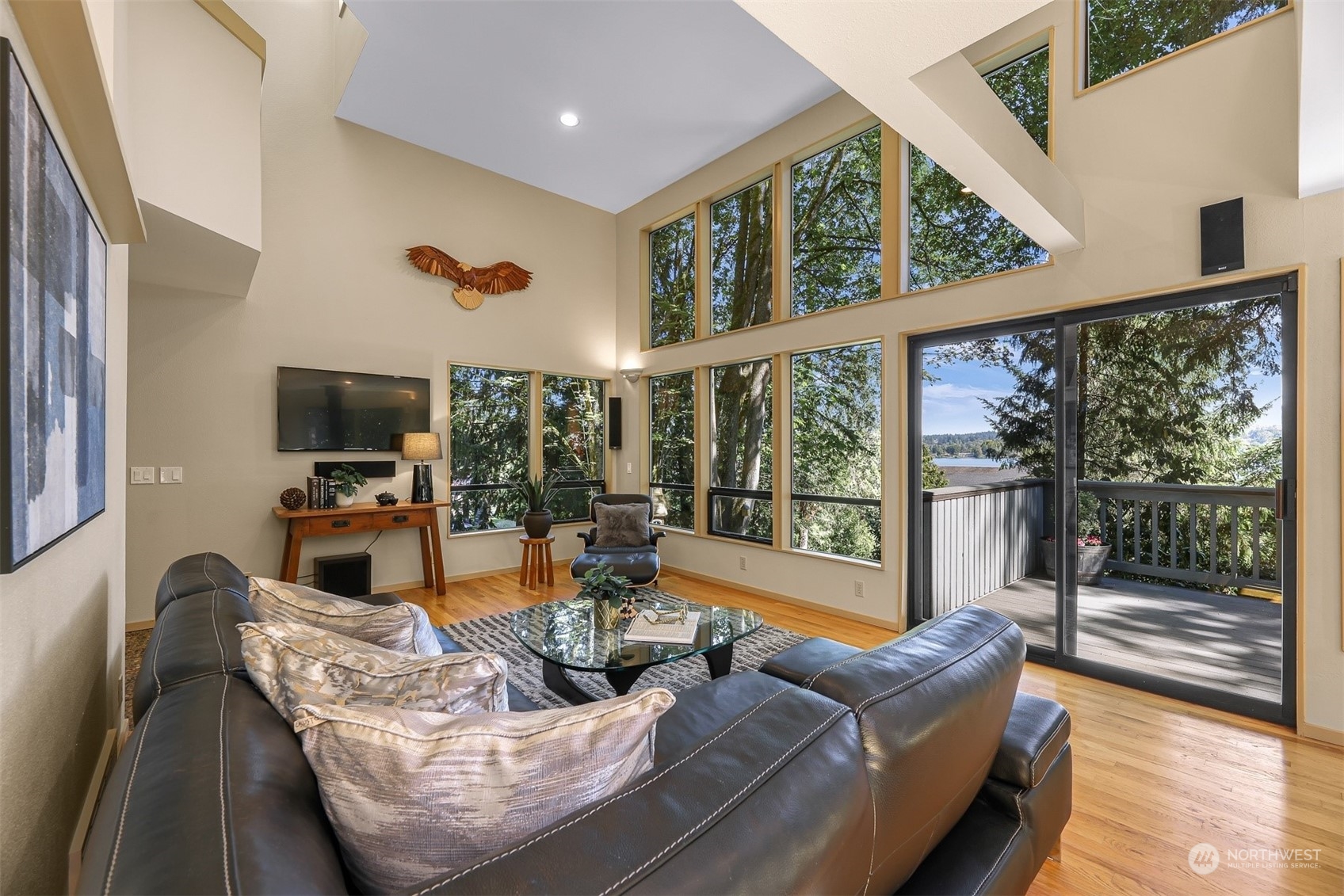 4431 Ferncroft Road Mercer Island, WA 98040 - Photo 7 of 40 a living room with furniture tv and large window