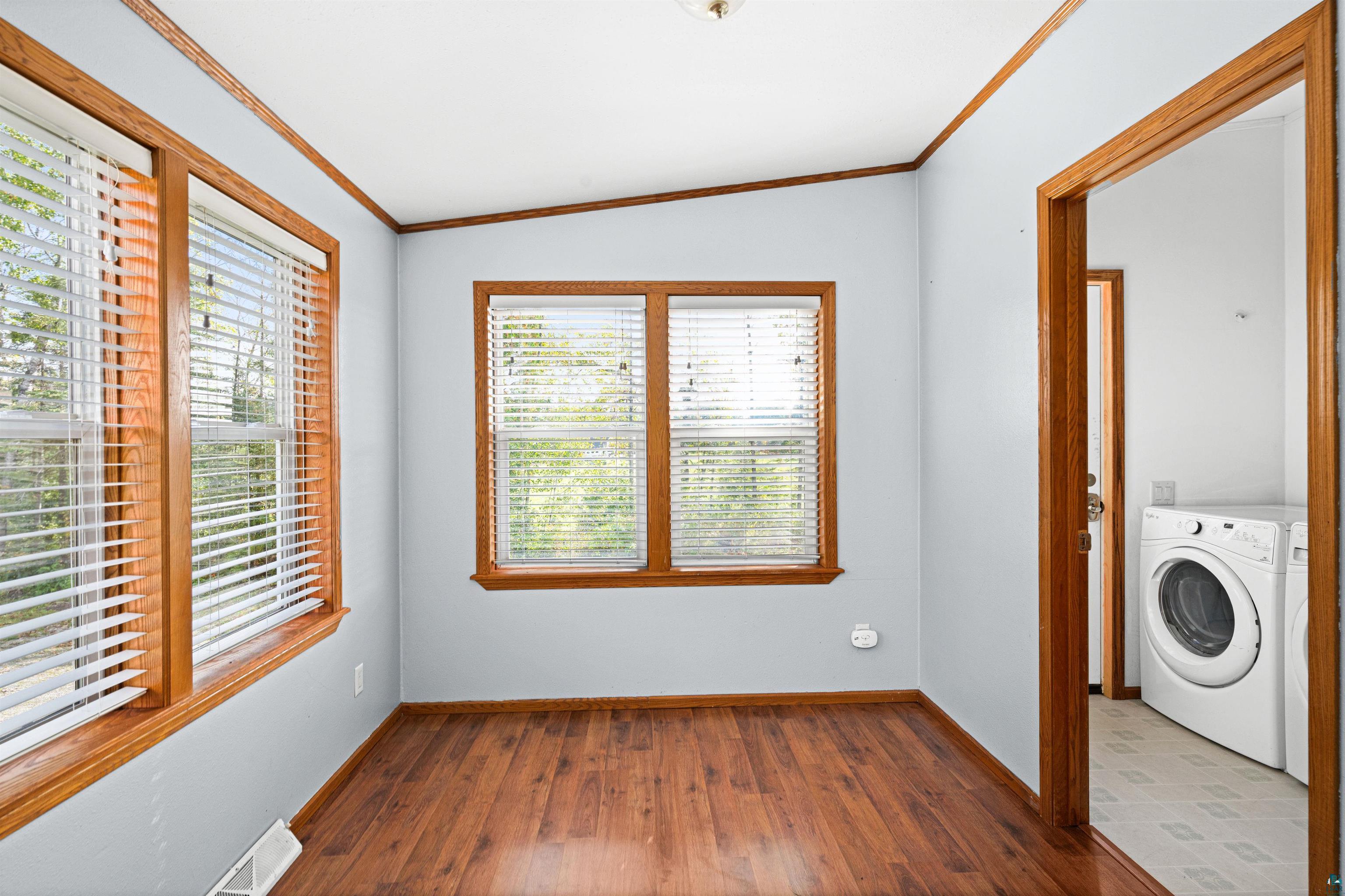 3126 Beyer Road Duluth, MN 55804 - Photo 13 of 23 Additional breakfast bay complemented w laminate flooring and natural style trim throughout this versatile room