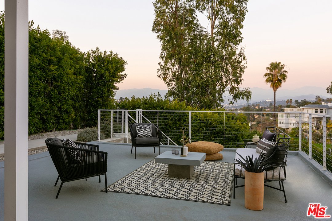 a view of a roof deck with couches
