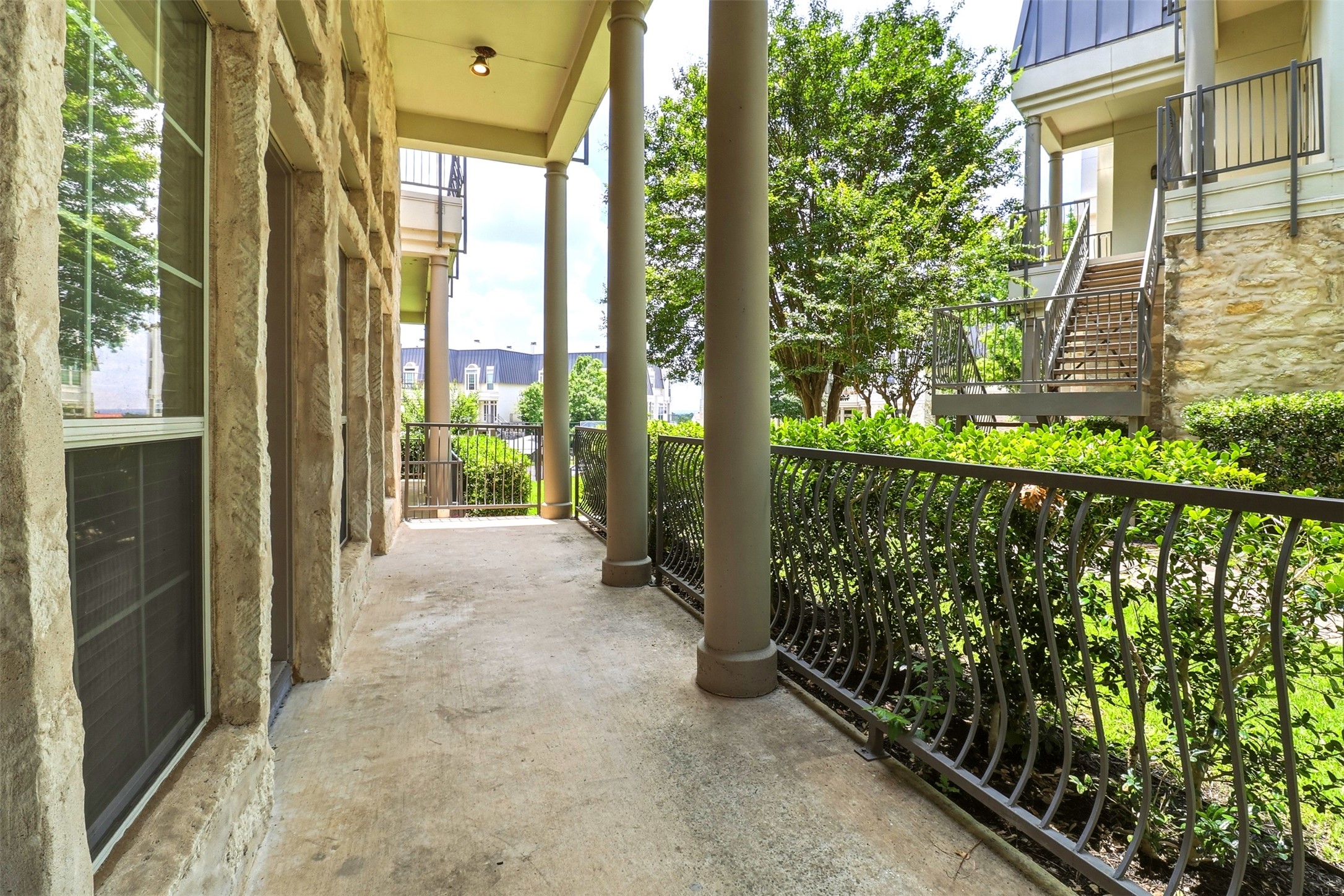2918 Ranch Road 620, Unit 265 Austin, TX 78734 - Photo 21 of 40 A classic covered patio offers a refreshing outdoor retreat with ornate railings.