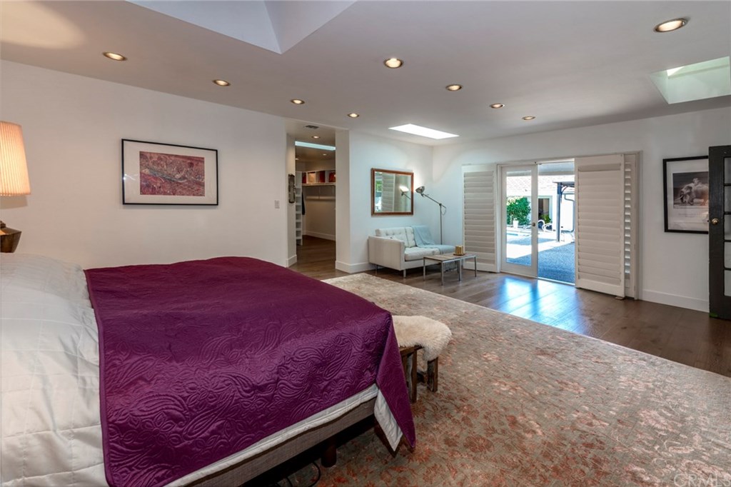 1425 Miramar Drive Fullerton, CA 92831 - Photo 19 of 55 a spacious bedroom with a bed and wooden floor