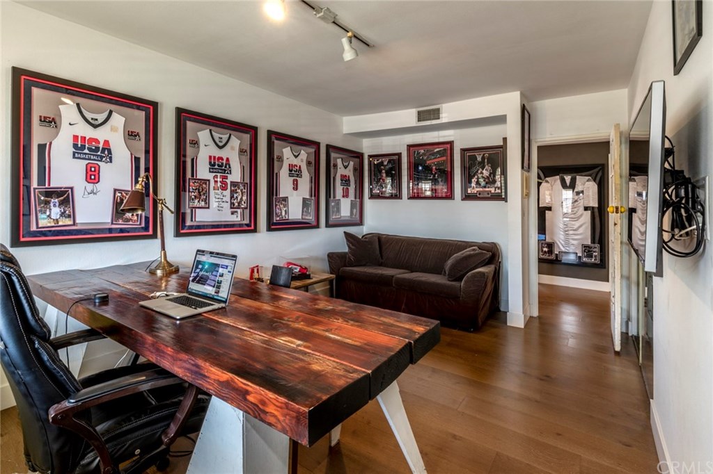 1425 Miramar Drive Fullerton, CA 92831 - Photo 22 of 55 a living room with furniture a rug and a bookshelf