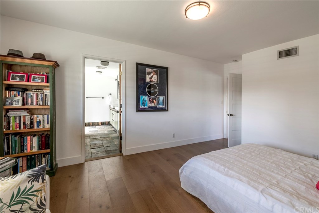 1425 Miramar Drive Fullerton, CA 92831 - Photo 25 of 55 a bedroom with bed and a book shelf
