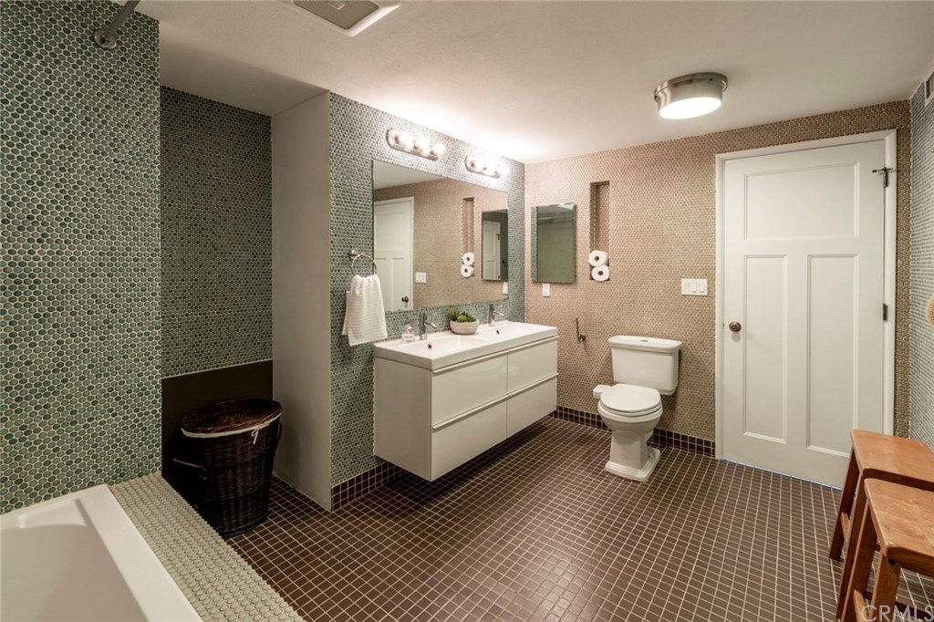 1425 Miramar Drive Fullerton, CA 92831 - Photo 29 of 55 a bathroom with a toilet a sink and mirror