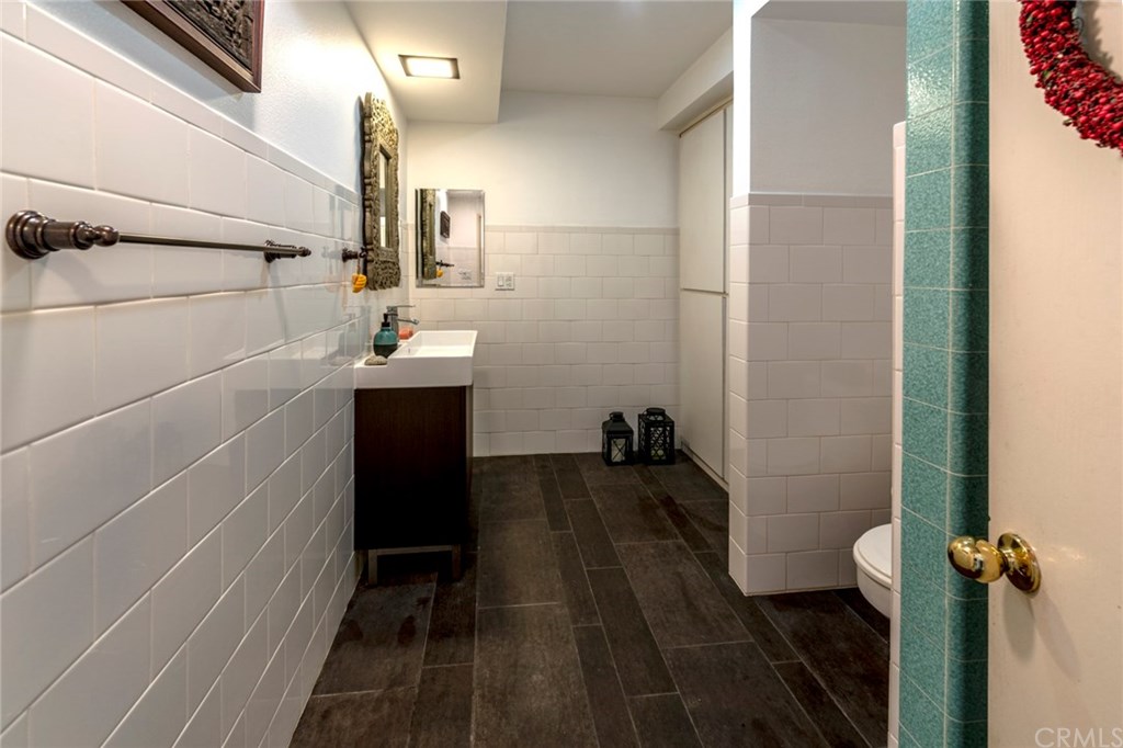 1425 Miramar Drive Fullerton, CA 92831 - Photo 35 of 55 a bathroom with a sink and mirror with toilet