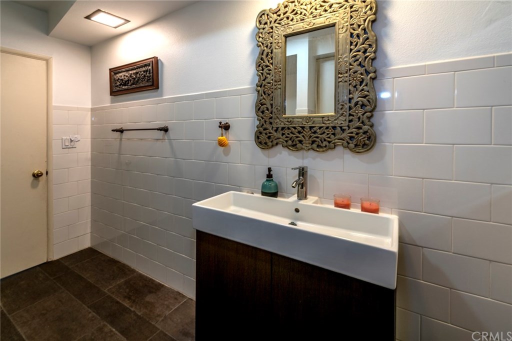 1425 Miramar Drive Fullerton, CA 92831 - Photo 36 of 55 a bathroom with a sink and a mirror