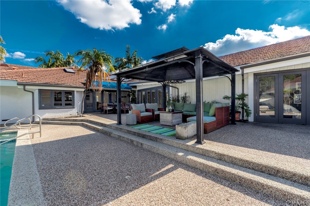 1425 Miramar Drive Fullerton, CA 92831 - Photo 45 of 55 a patio with a table and chairs and potted plants