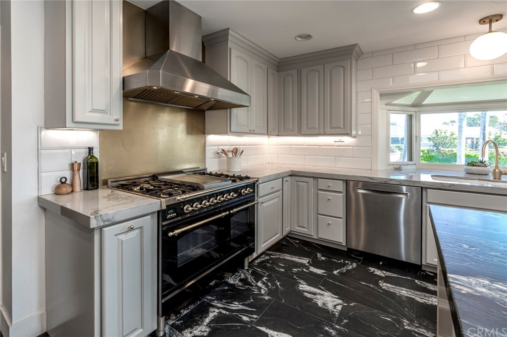 1425 Miramar Drive Fullerton, CA 92831 - Photo 8 of 55 a kitchen with granite countertop a stove sink and cabinets