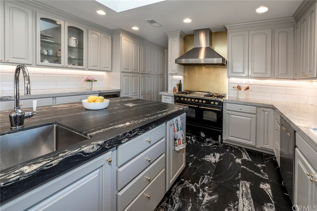 1425 Miramar Drive Fullerton, CA 92831 - Photo 9 of 55 a kitchen with a sink stove and cabinets