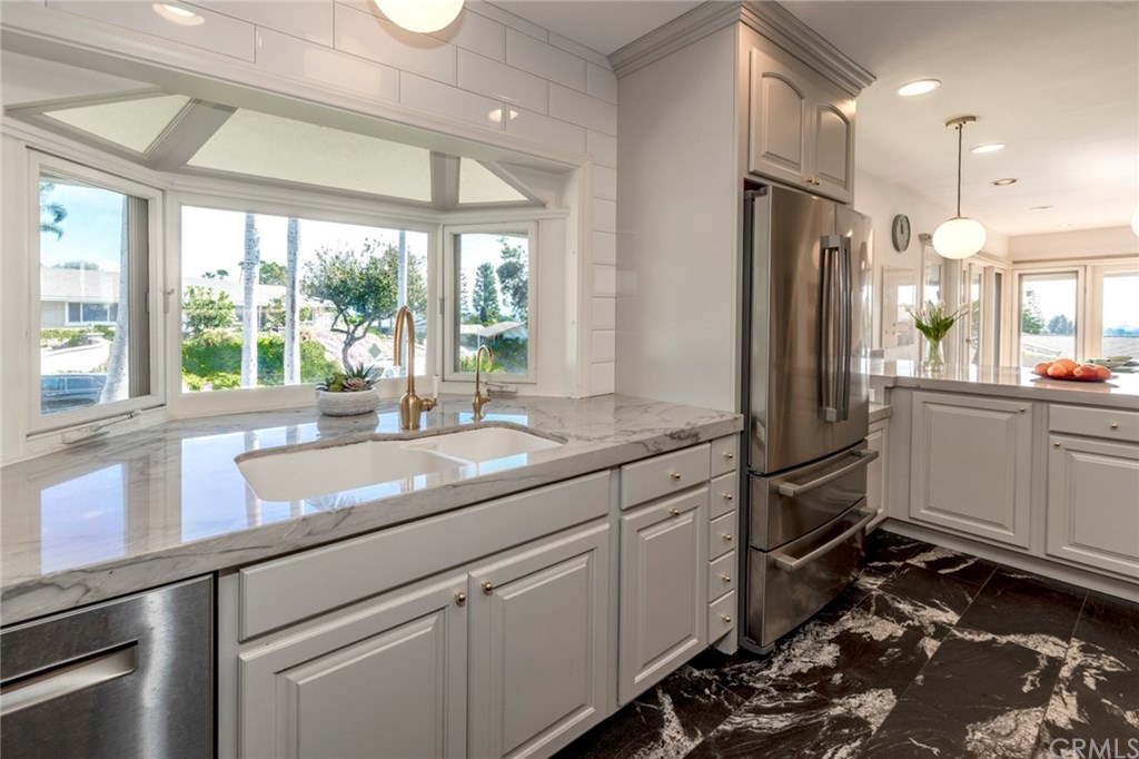 1425 Miramar Drive Fullerton, CA 92831 - Photo 10 of 55 a kitchen with a sink stove and refrigerator