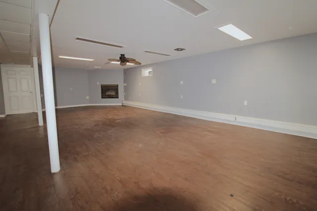 an empty room with a empty space and a ceiling fan