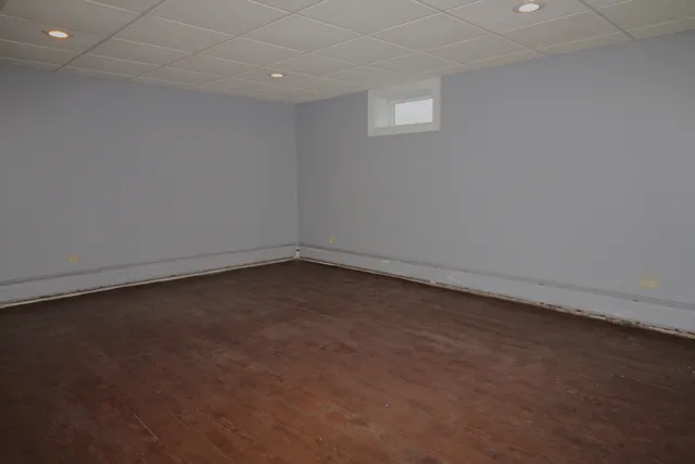 an empty room with a empty space and a window