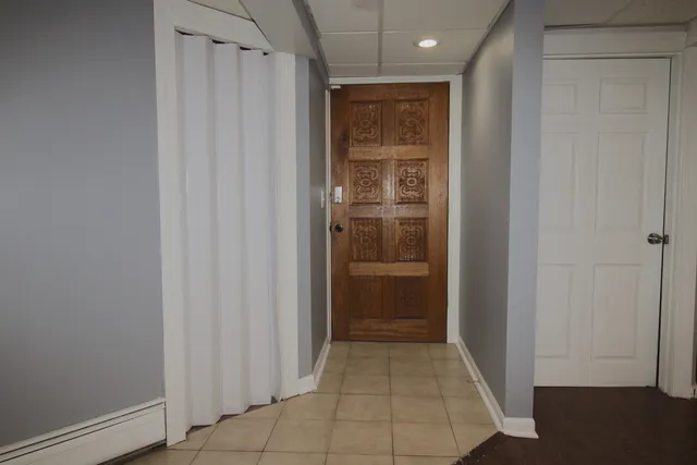 a view of entryway with white door